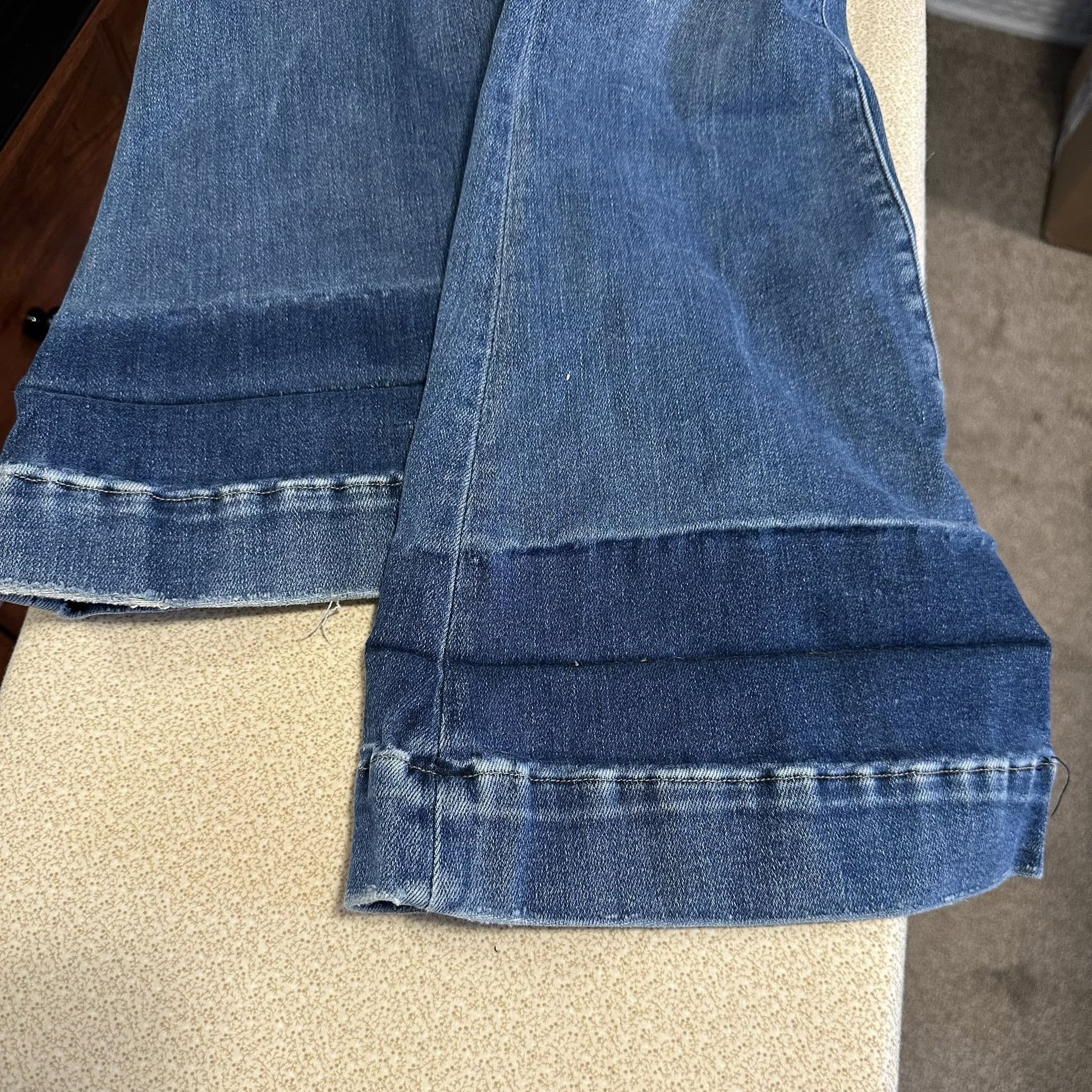 Damaged jeans — before repair